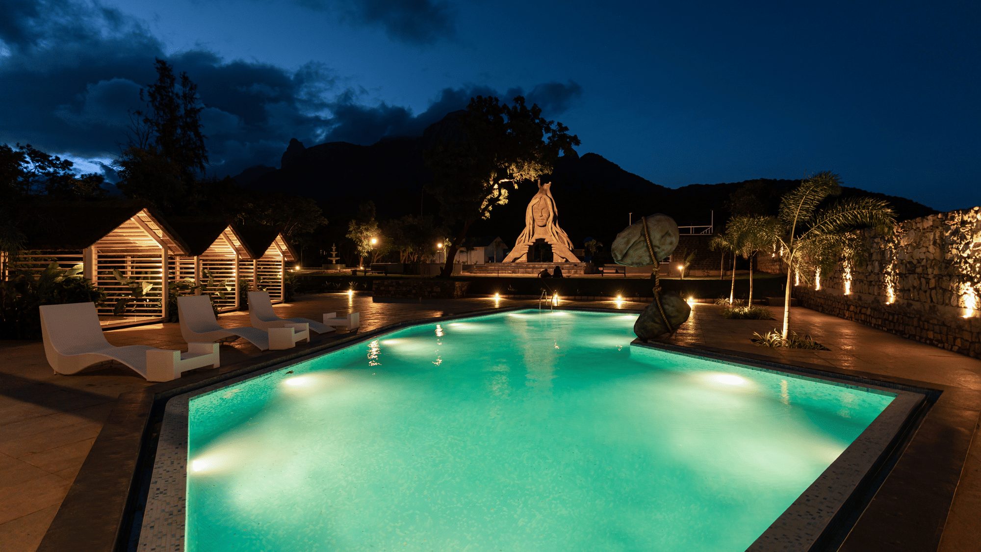 Illuminated pool at Darza Luxury Resort at night