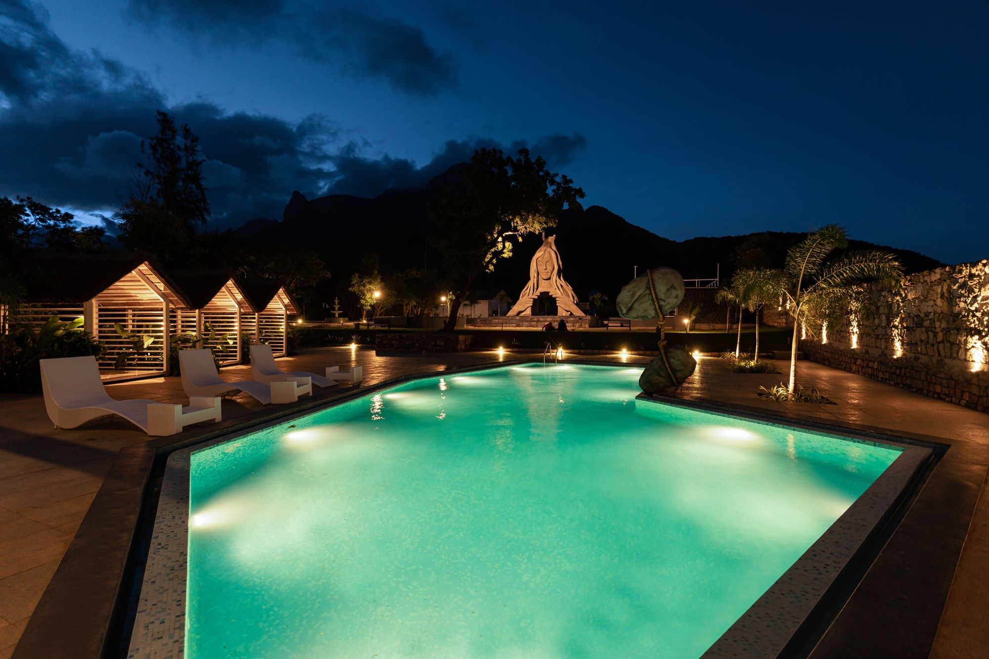 Aquamarine pool lit at night at Darza Luxury Resort
