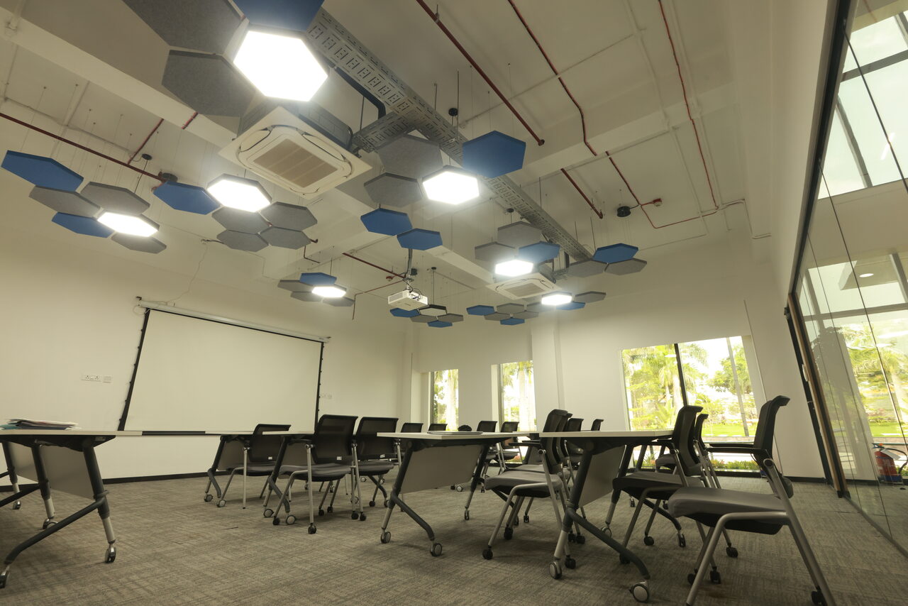 Makino meeting room with recessed downlights and acoustic ceiling baffles